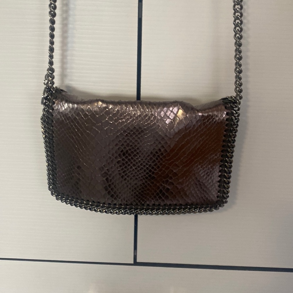Stella McCartney like new metallic silver snake crossbody bag.